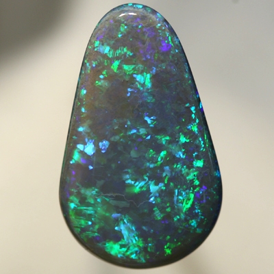 SOLID BLACK OPAL Huge, top quality. With Green and turquoise endlessly sparkling. SEE VIDEO